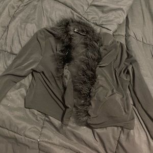 Cropped sweater with fur neck lining.